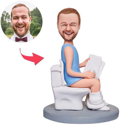 Personalised man-on-toilet reading bobblehead with engraved text — handcrafted polymer clay figurine, custom head made from your photo, novelty personalised keepsake