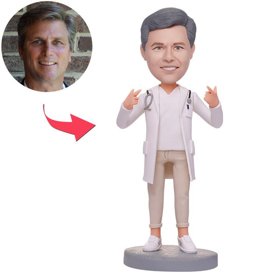 Personalised doctor bobblehead with stethoscope — hand-sculpted polymer clay mini-me, custom head and engraved text; ideal gift for GPs, NHS doctors and medical graduates in the UK and Australia