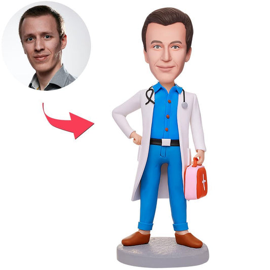 Personalised male doctor bobblehead holding a first aid kit – custom polymer figurine with personalised head likeness and engraved name on the base, ideal NHS doctor gift and GP thank you present.