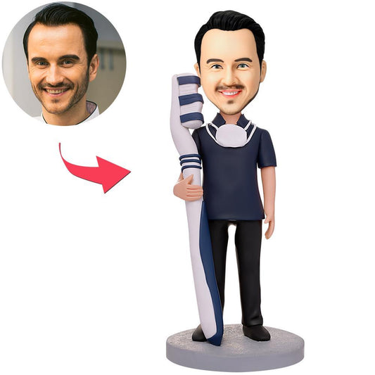 Male dentist bobblehead holding a toothbrush – personalised head matched to your photo with engraved text on the base, handmade polymer clay gift for dentists and dental graduates