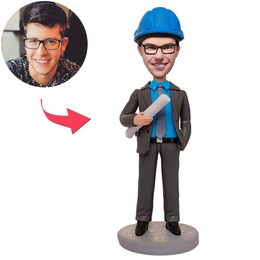 Custom engineer bobblehead holding blueprints with personalised face and engraved text on the base, handcrafted polymer clay keepsake gift for engineers