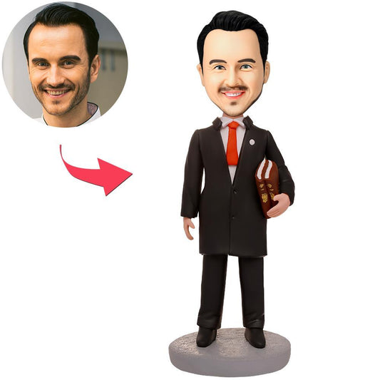 Personalised male lawyer bobblehead holding a book – handmade polymer clay barrister figurine with custom face photo and engraved base, ideal solicitor graduation or desk gift