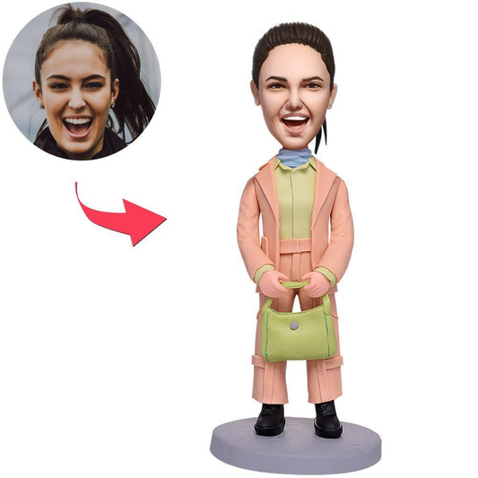 Personalised polymer clay bobblehead of a modern woman in a pink suit with engraved text on the base — custom gift for her, ideal personalised bobblehead for UK and Australia