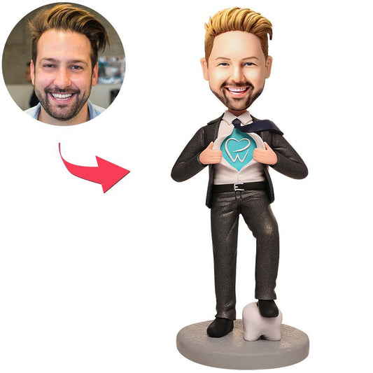 Personalised dentist bobblehead with clinic logo — front view of hand-sculpted polymer clay face sculpted from your photo, dental uniform keepsake
