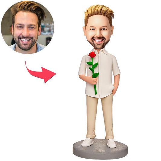 Handcrafted personalised polymer clay man bobblehead holding a red rose with an engraved base showing custom text — personalised bobblehead gift Australia, engraved bobblehead
