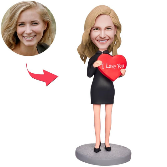 Personalised woman holding love heart bobblehead – handcrafted polymer clay keepsake with engraved text, front view, perfect romantic gift