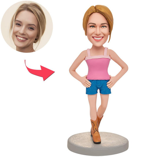 Personalised polymer clay bobblehead of a woman wearing suspenders with engraved name on the base — bespoke keepsake gift