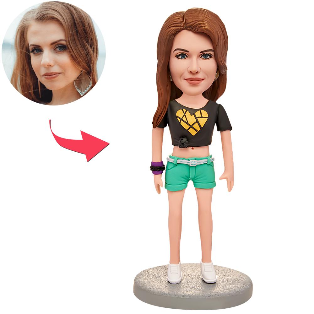 Personalised polymer clay bobblehead wearing a heart T‑shirt; custom head sculpted from your photos with engraved text on the base — the perfect personalised bobblehead gift or keepsake.