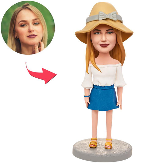 Handcrafted polymer clay girl bobblehead in white clothes with personalised head likeness and engraved base — perfect birthday or anniversary gift in the UK and Australia