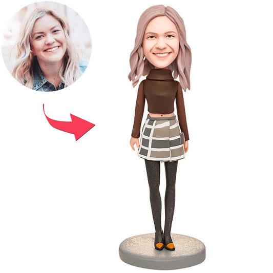 Personalised dress-fashion woman bobblehead — polymer clay figurine with custom photo-based head and engraved base, ideal personalised gift for birthdays and anniversaries in the UK and Australia