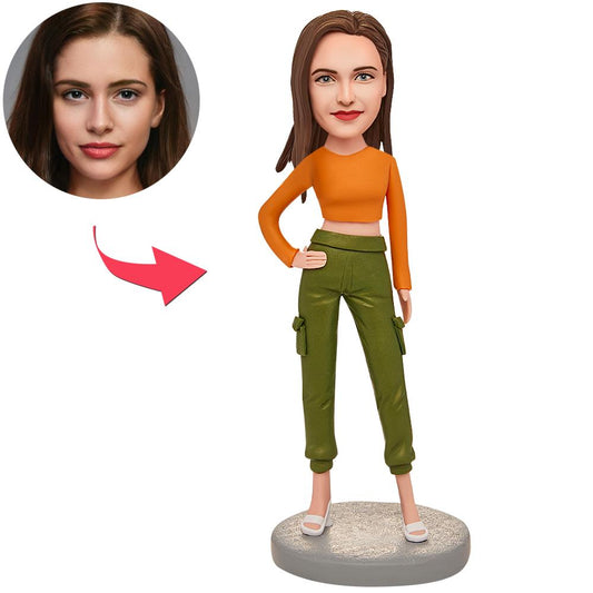 Orange Modern Woman personalised bobblehead in contemporary orange outfit, polymer clay figurine with customised head sculpt and engraved text on base