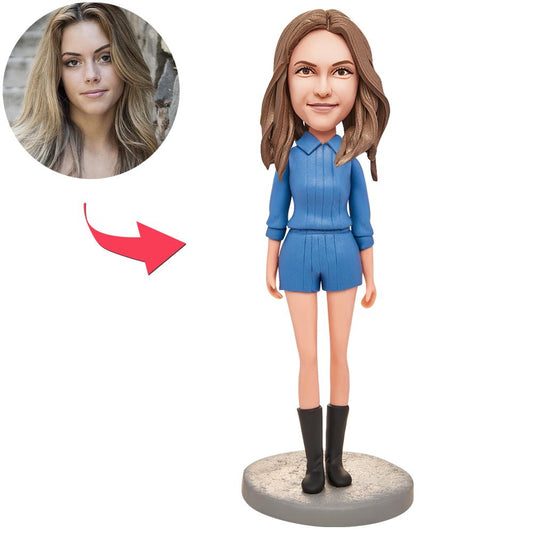 Handcrafted polymer clay personalised bobblehead of a woman in a blue suit with engraved name on the base, ideal personalised gift