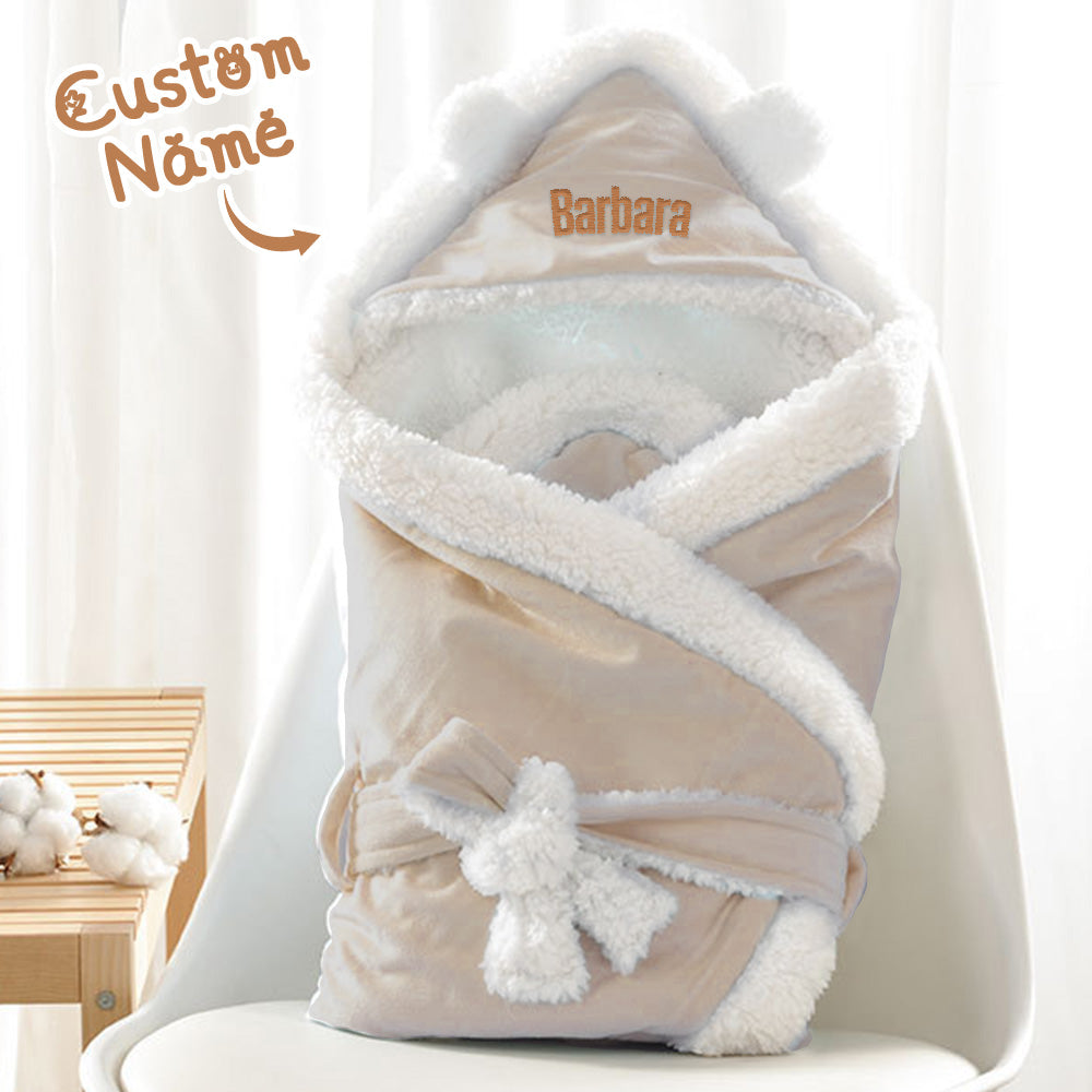 Close-up of embroidered name on soft polyester baby swaddle — personalised keepsake baby blanket, quality stitching and cosy texture