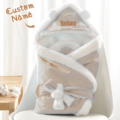 Close-up of embroidered name on soft polyester baby swaddle — personalised keepsake baby blanket, quality stitching and cosy texture