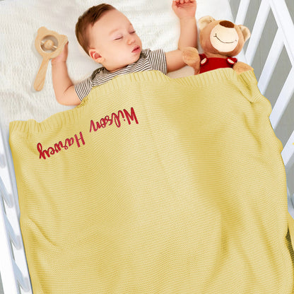 Close-up of embroidery on the blanket showing neat stitching.