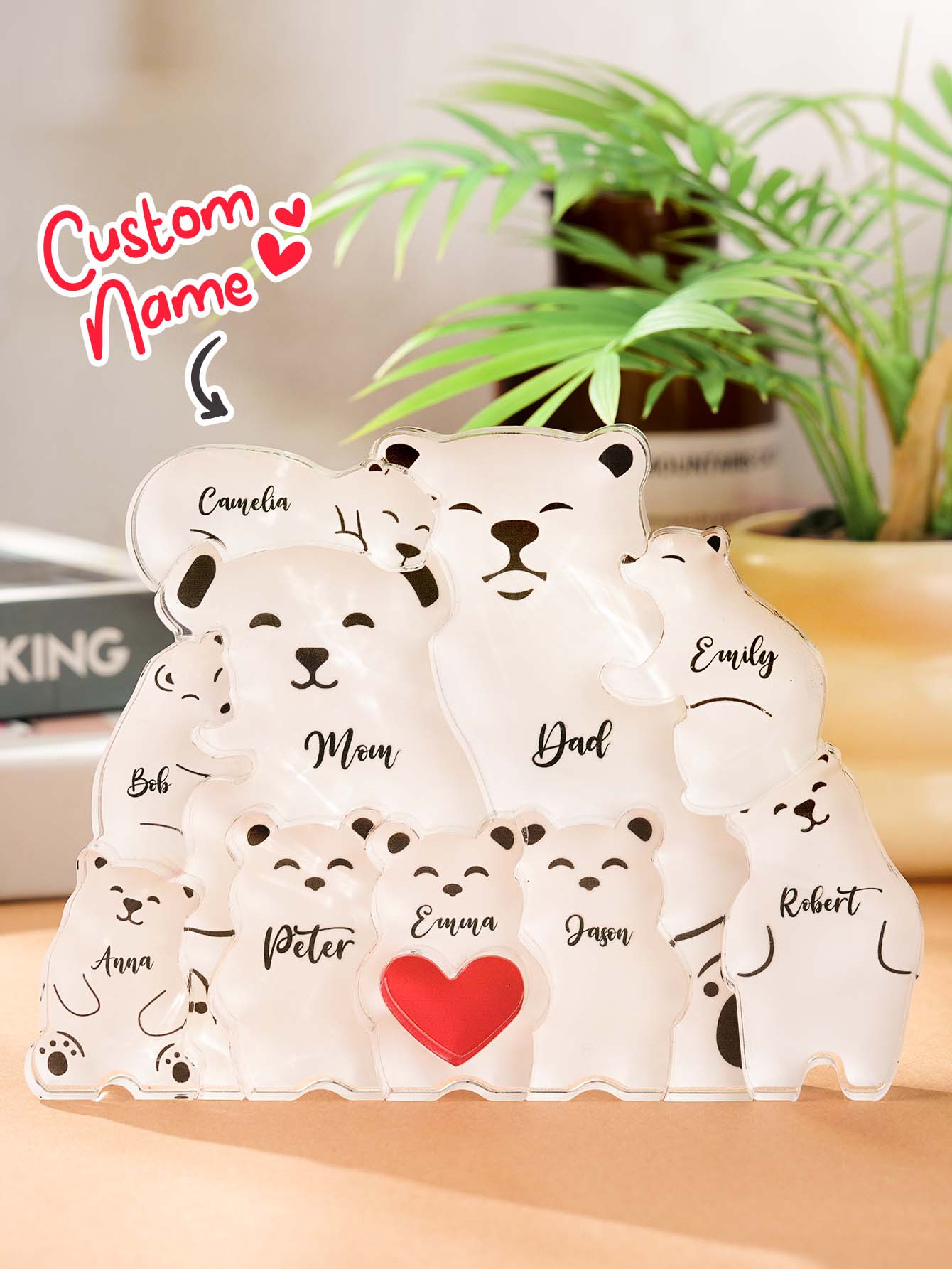 Personalised acrylic bear puzzle photographed against a neutral background to emphasise engraved family names and modern design