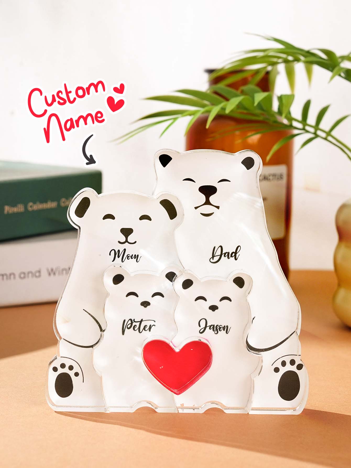Multiple personalised acrylic bear puzzles displayed together, showing different name layouts and family sizes