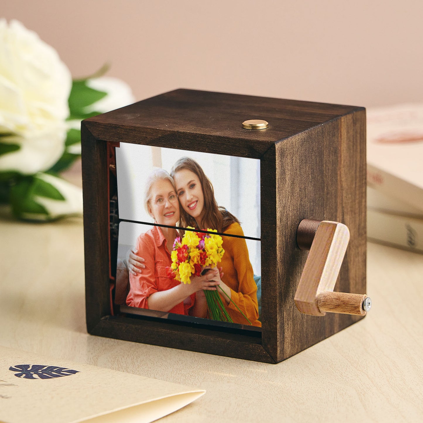 Detail of the compact 8.8 cm square frame showing PVC, wood and clear acrylic construction.