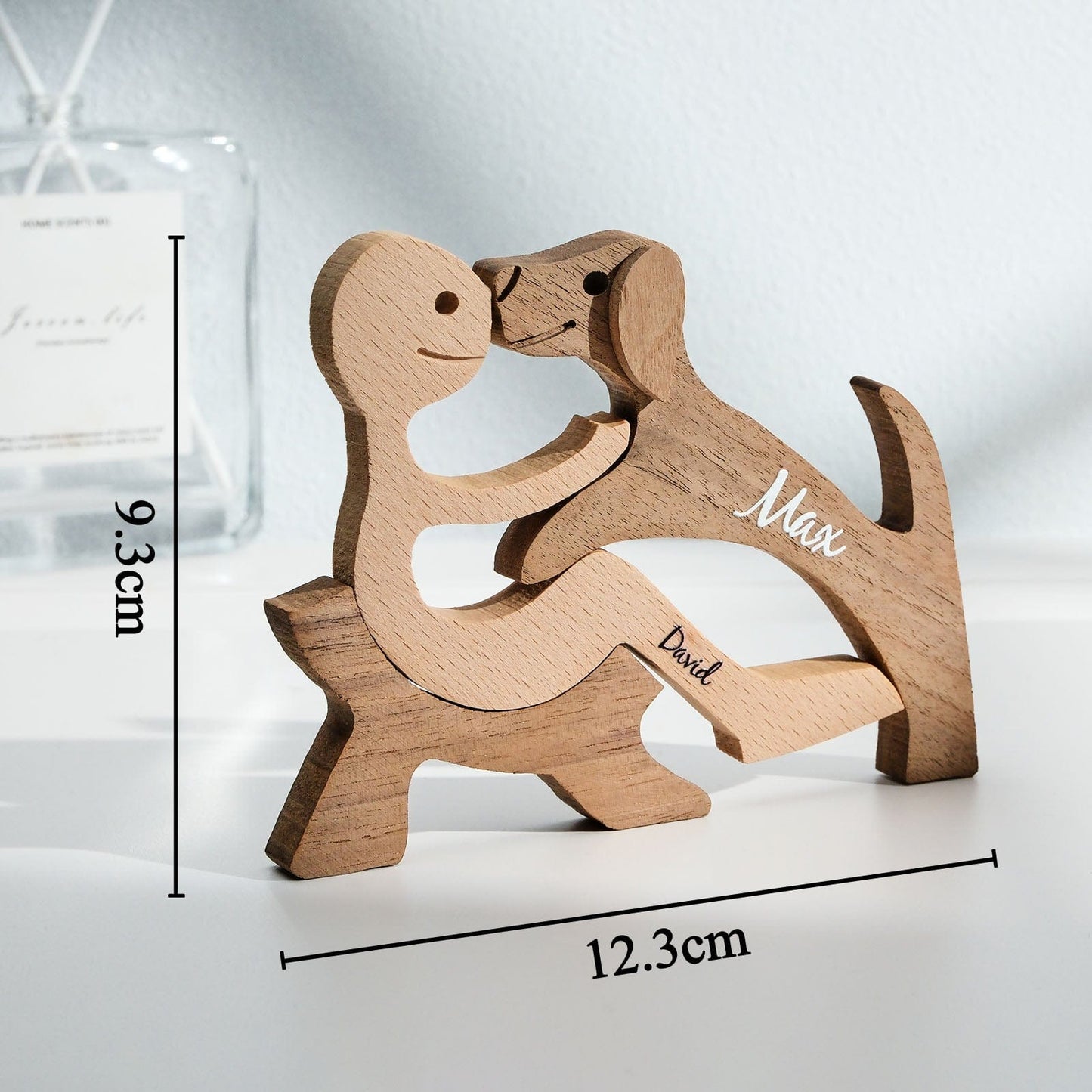 Personalised wooden pet carving block displayed on a shelf with decorative accents — thoughtful personalised pet memorial gift