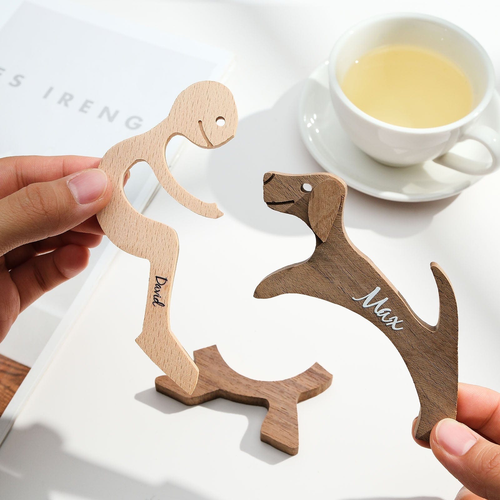Angled close-up of personalised wooden pet carving block highlighting precision engraving and natural wood grain — bespoke pet name keepsake