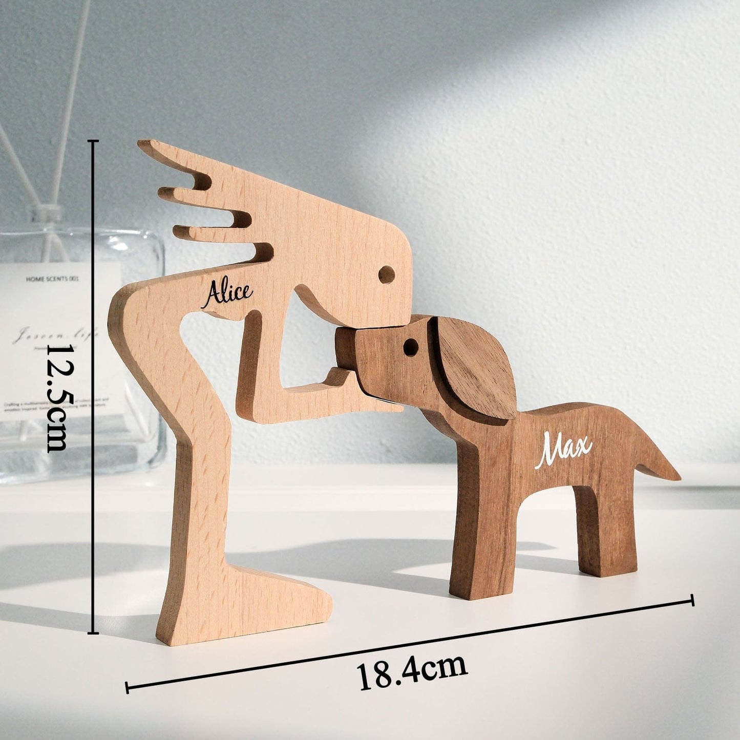 Personalised wooden pet carving block displayed on a desk with stationery — bespoke engraved name table decor for home or office