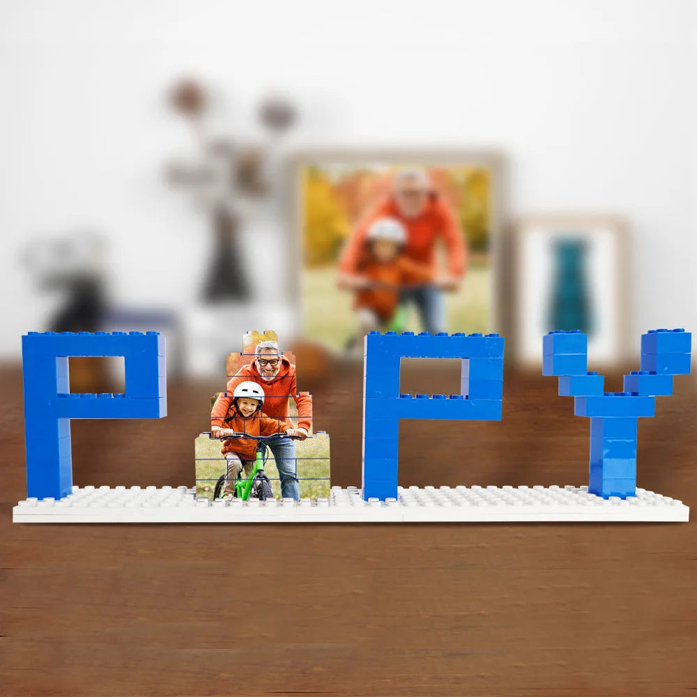 Hand holding a personalised photo brick puzzle — compact 22.4×8.5×4.8 cm display gift