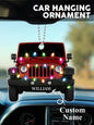 Lifestyle image of personalised car Christmas ornament hanging on a decorated tree, engraved name catching the light on clear acrylic