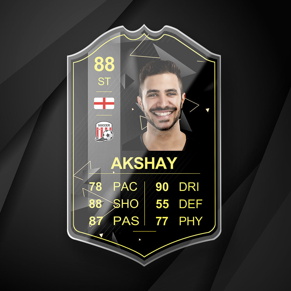 Angled view of S22 Gold Inform personalised football card in acrylic displaying player stats, country flag and grading score — personalised football present