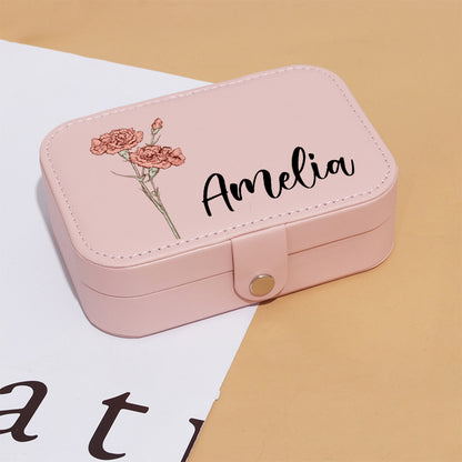 Travel jewellery organiser filled with rings, earrings and a bracelet — multi-compartment layout keeps jewellery organised