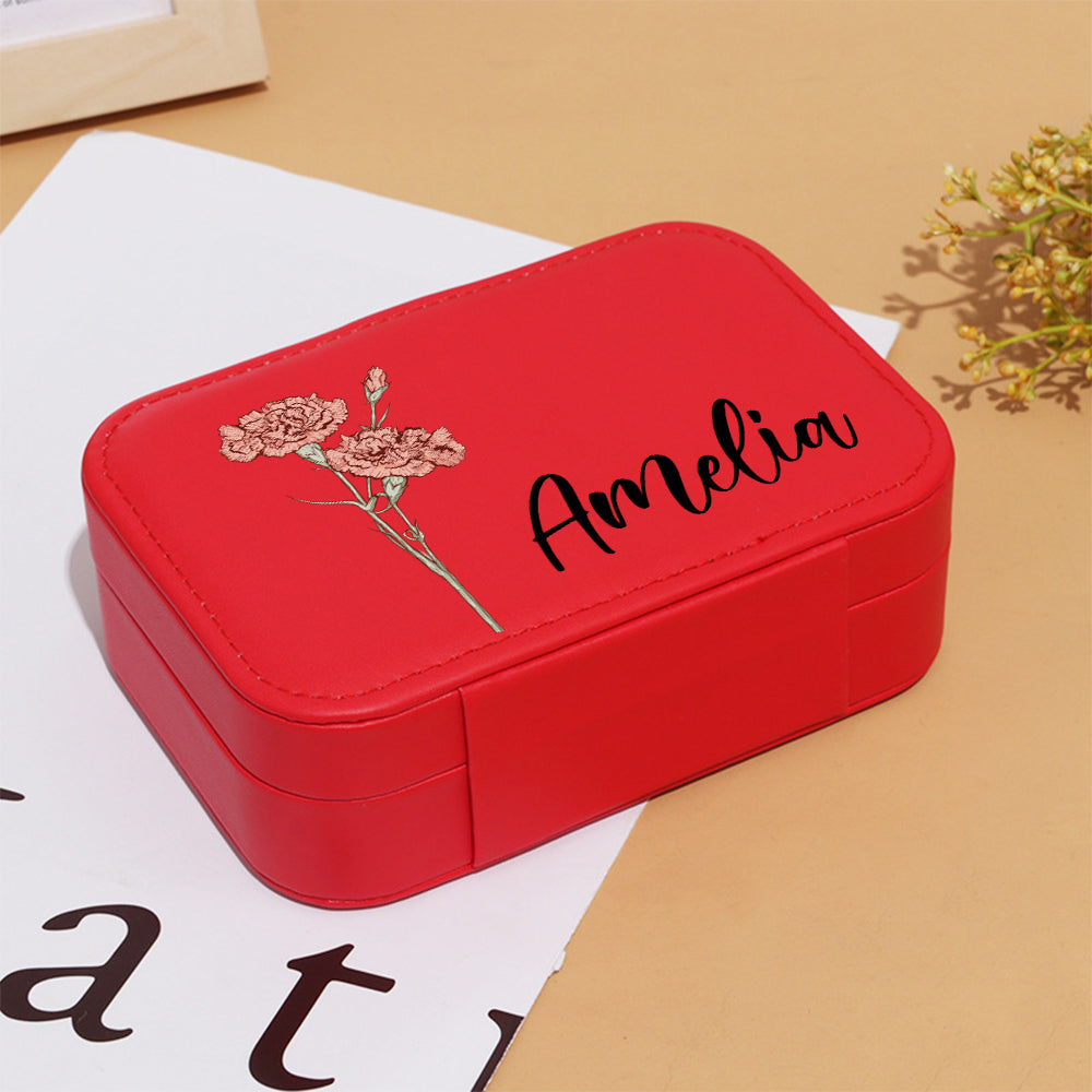 Top-down view of multi-compartment layout with cushioned ring rolls, earring slots and necklace hooks in personalised box