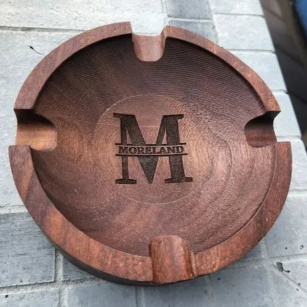 Walnut engraved cigar rest styled in a study with cigar and glass – elegant Father's Day gift and man‑cave accessory
