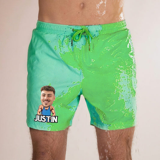 Personalised colour-changing beach shorts in green-to-blue gradient with customised face and name print on fast-drying polyester, thermochromic swim trunks