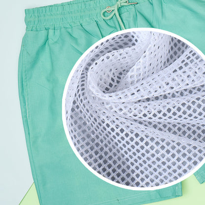 Close-up detail of personalised face and name print on thermochromic fabric, high-resolution cutout and vibrant green to blue gradient on polyester shorts