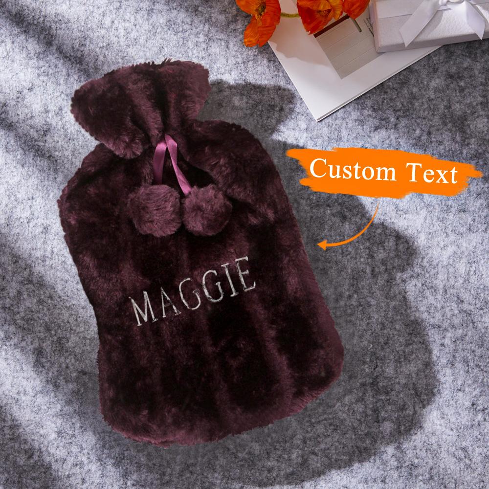 Personalised plush hot water bottle in colour variant with embroidered name visible, cosy bedside accessory and gift for her or him
