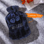 Personalised embroidered hot water bottle presented on a soft surface, highlighting plush texture and excellent heat retention