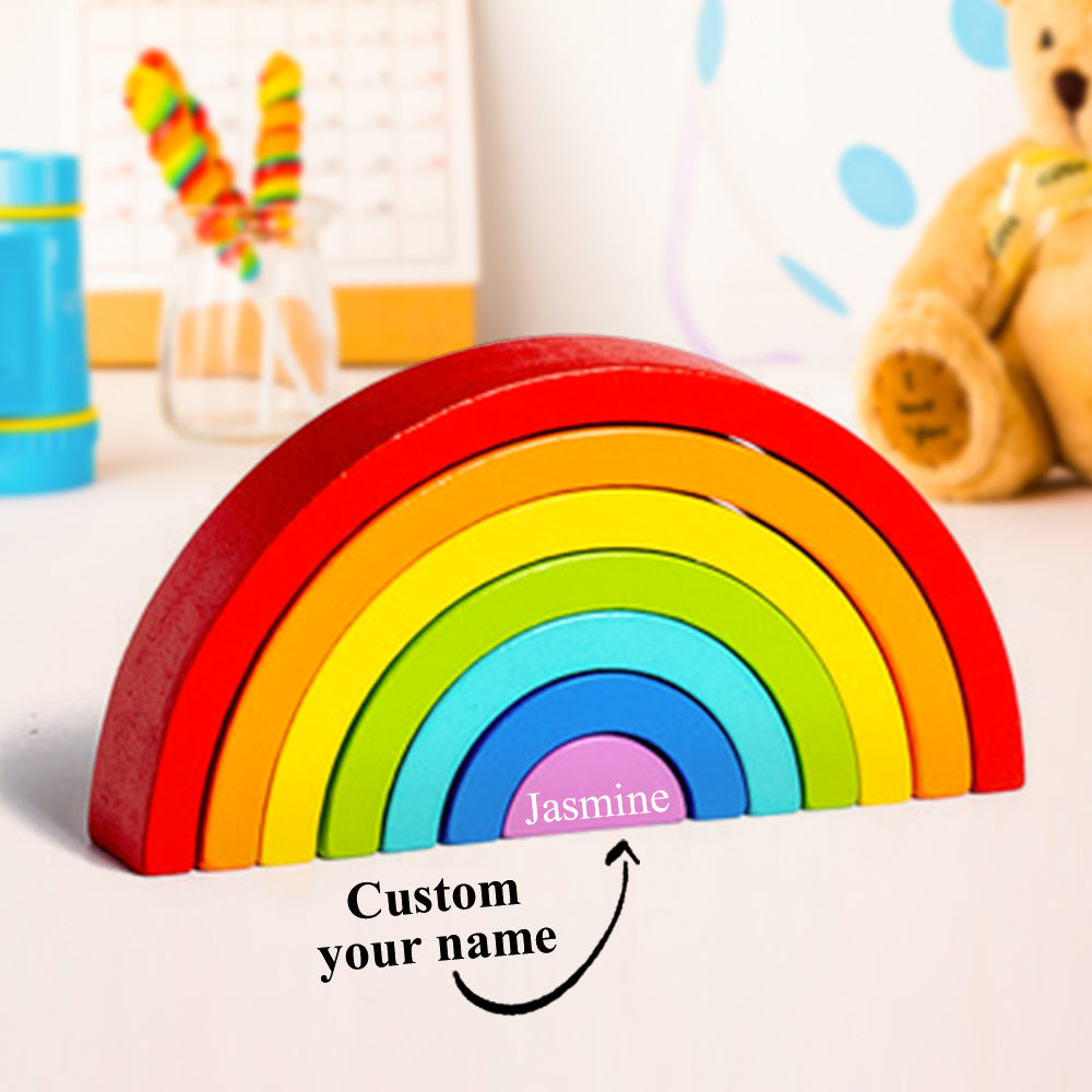 Pieces spread out to show the six-part wooden rainbow set for stacking, nesting and open-ended imaginative play