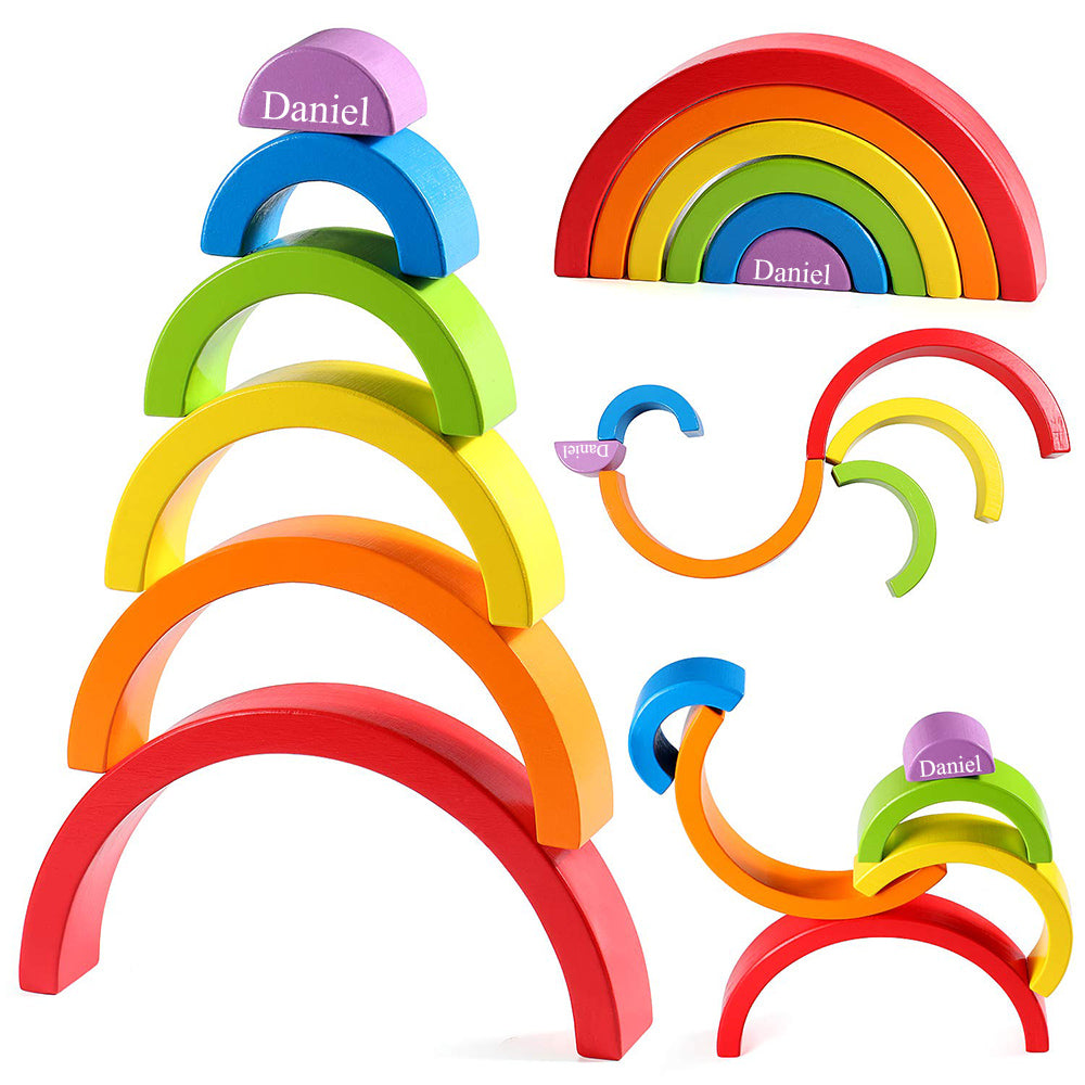 Flat-lay of natural wooden stacking toy showing each arch in earth colours – versatile Montessori decor and educational toy