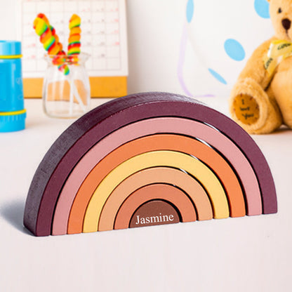 Wooden rainbow stacker pieces arranged as building blocks for imaginative play – Montessori stacking arches in natural tones