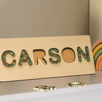 Selection of personalised acrylic name puzzles in different colourways — Montessori baby gifts and keepsakes