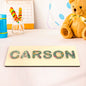Close-up of an acrylic letter edge and smooth non-toxic finish on a personalised name puzzle for toddlers