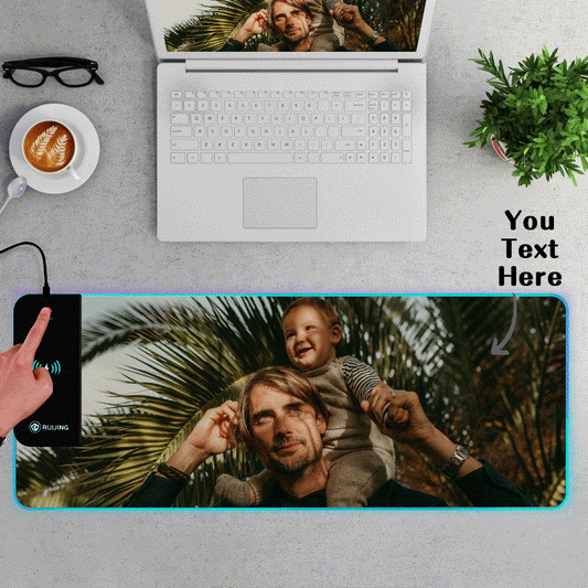 RGB wireless-charging gaming mouse pad with personalised LED border cycling through colours, showing Qi charging zone and vivid custom print for gamers