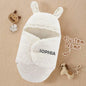 Swaddle shown in a simple, easy-to-wrap presentation.