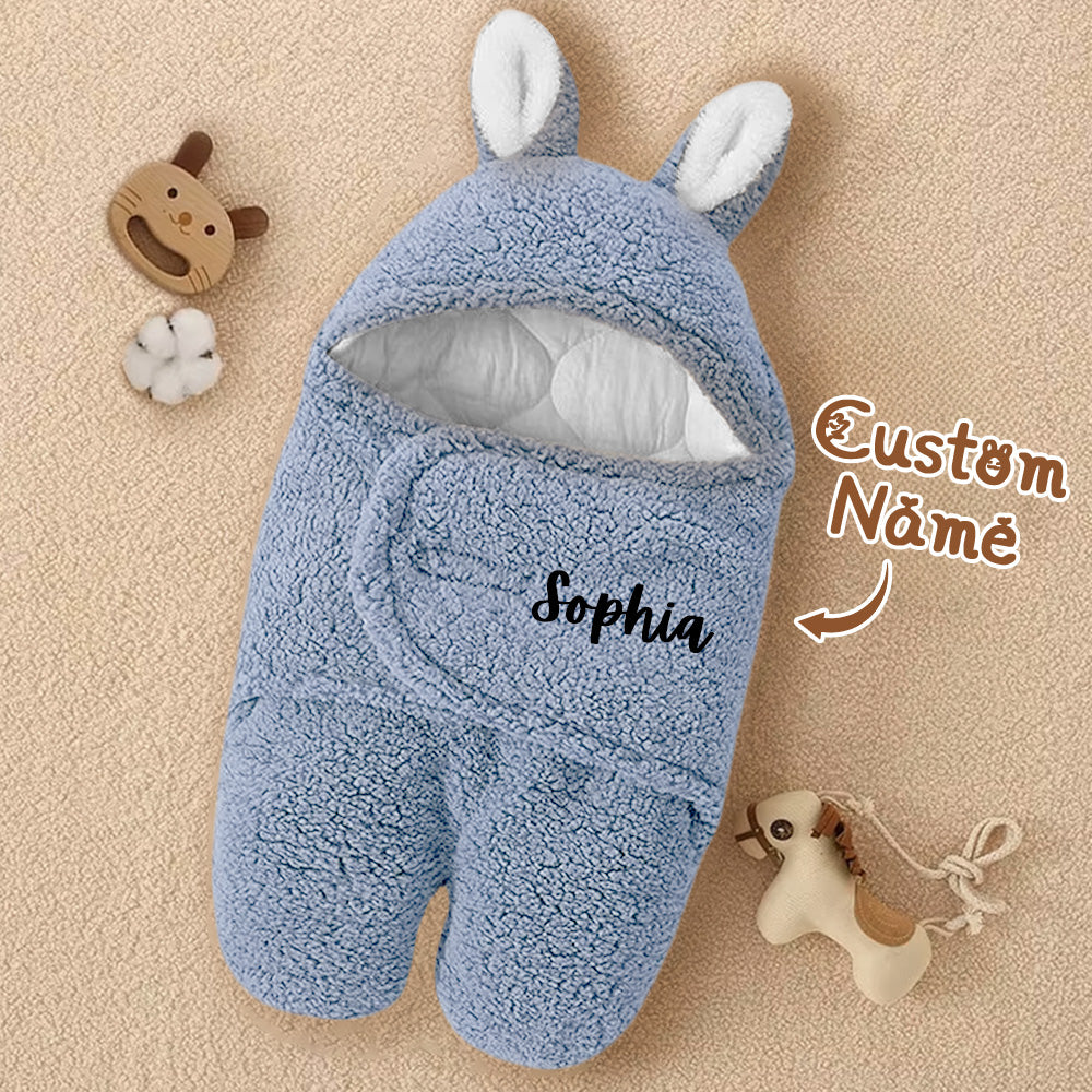 Hood with bunny ears feature accent on the swaddle.