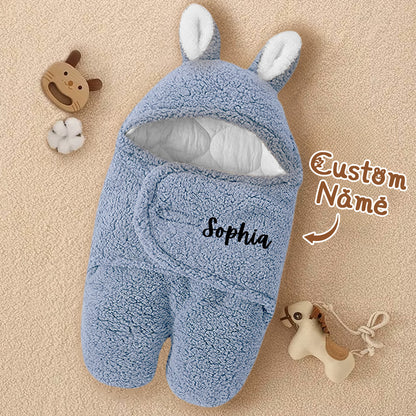 Hood with bunny ears feature accent on the swaddle.