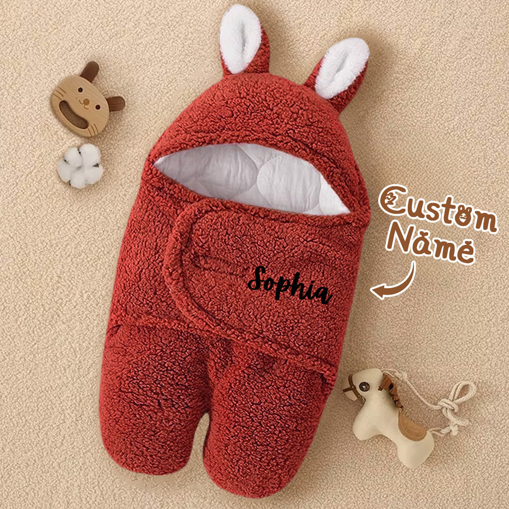 Hood with bunny ears feature accent on the swaddle.