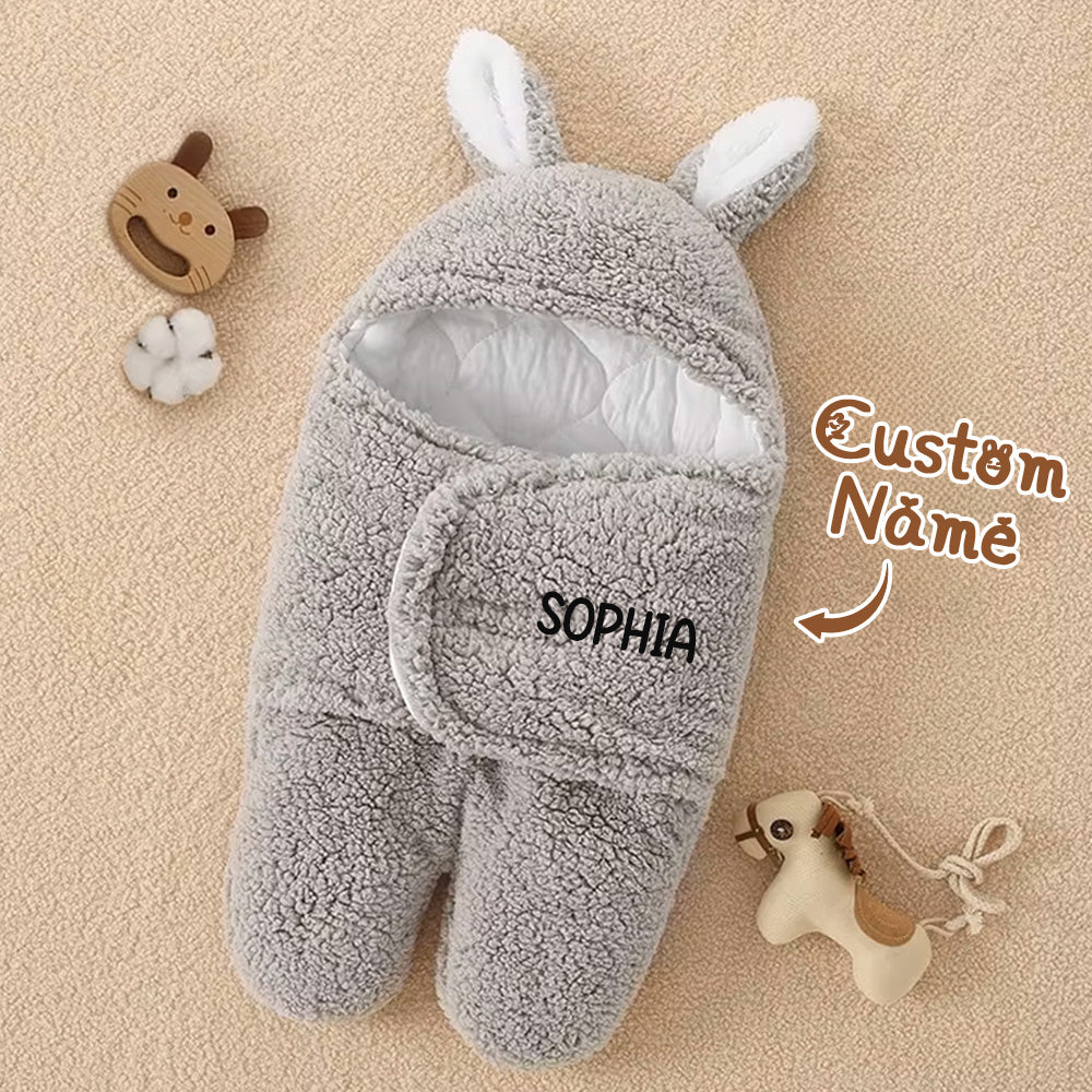 Demonstration of personalised name option on the swaddle.