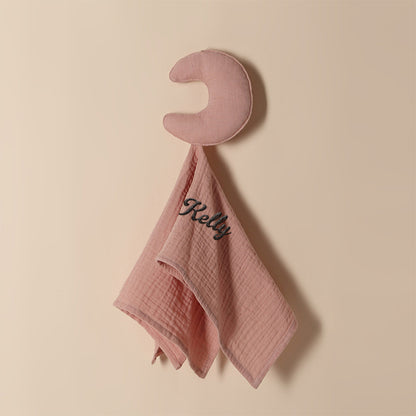 Baby towel personalised with embroidered name shown beside soft toys, premium cotton comforter for cuddles and sleep