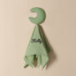 Personalised baby towel photographed with measuring guide to show 15in x 15.75in size, embroidered name detail included