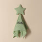 Personalised baby towel arranged with baby accessories to highlight embroidered name and star design, ideal new arrival gift