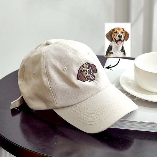 Personalised embroidered pet hat in beige showing a detailed custom dog portrait on the front panel, custom pet photo cap